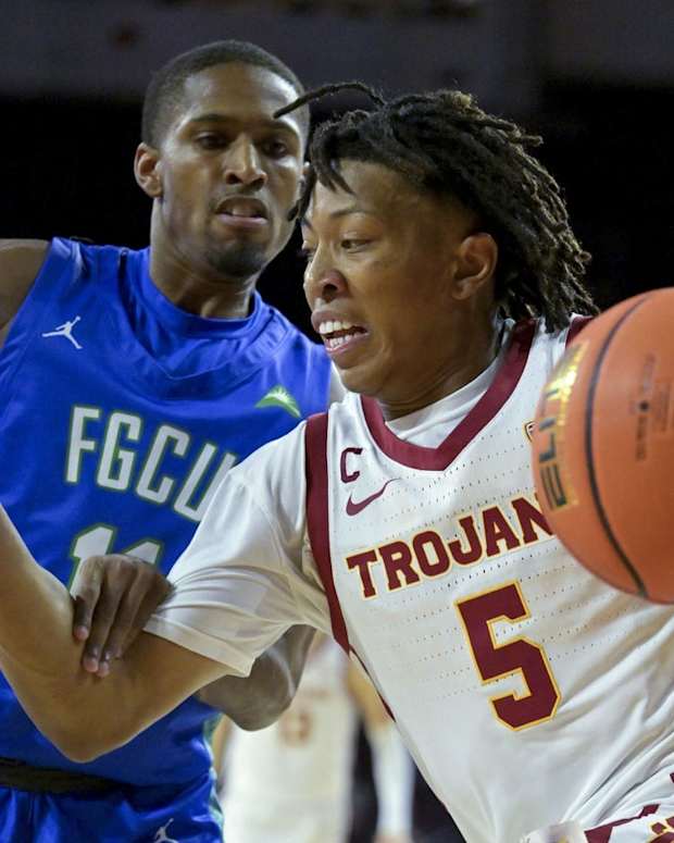 Nov 7, 2022; Los Angeles, California, USA; Florida Gulf Coast Eagles guard Isaiah Thompson (11) defends USC Trojans guard Boogie Ellis (5) as he drives to the basket in the first half at Galen Center. Mandatory Credit: Jayne Kamin-Oncea-USA TODAY Sports